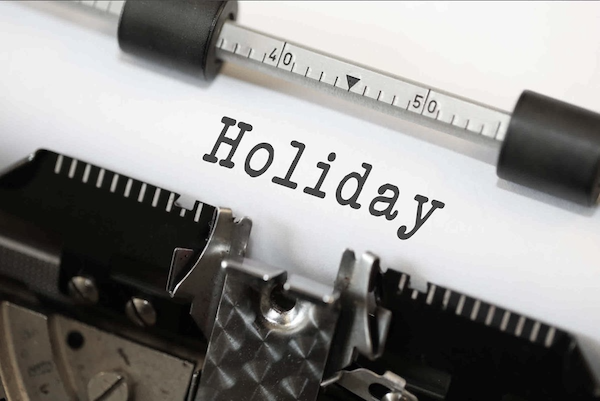 typewriter with the word holiday